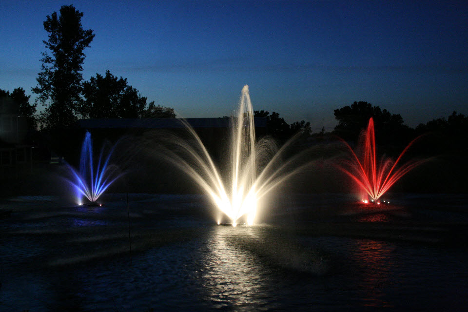 Colored lighting adds dramatic evening effects of Kasco fountains.